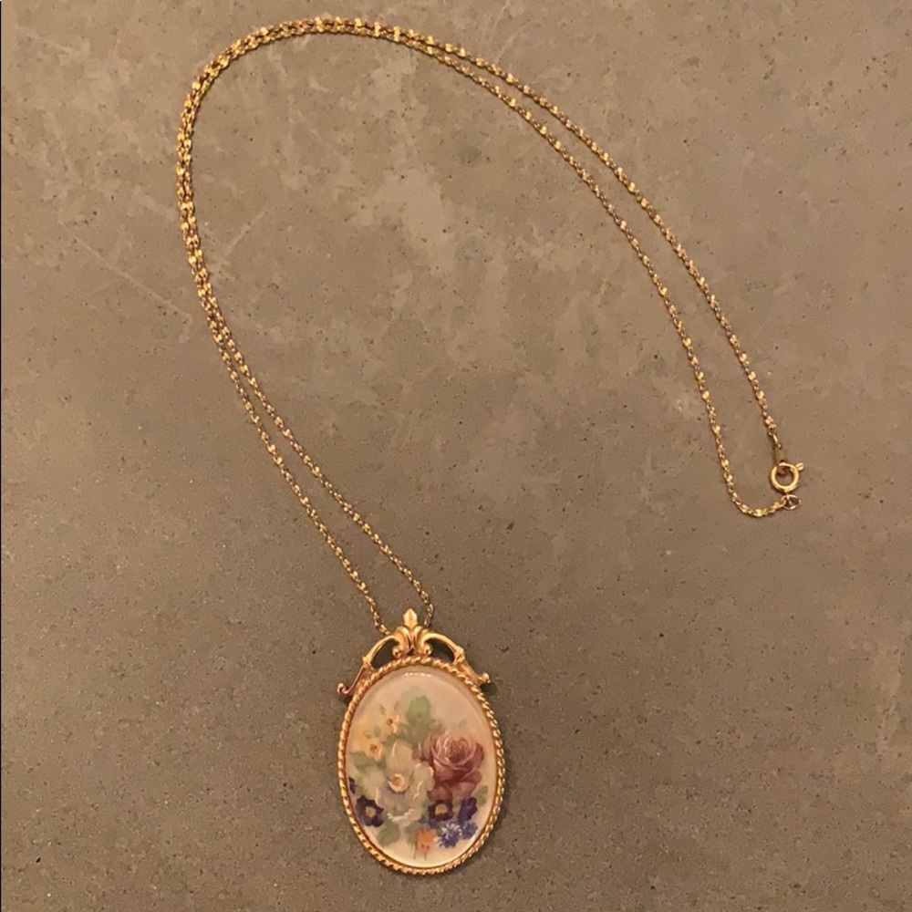 Gold necklace with floral charm
